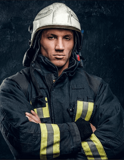 Female firefighter with helmet and protective gear