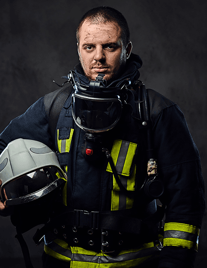 Male firefighter in breathing apparatus